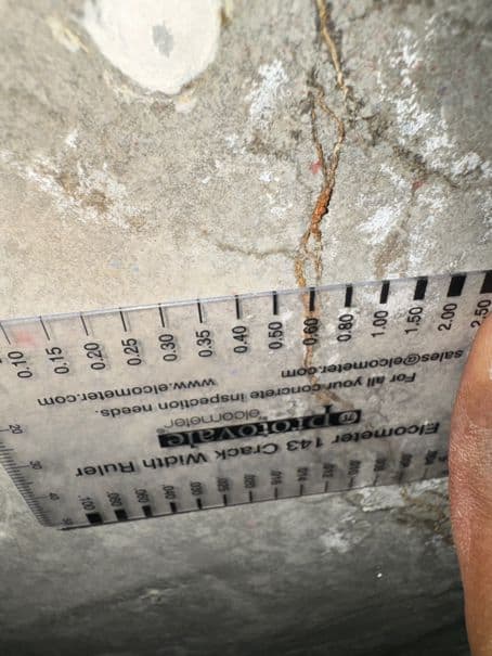 Close-up of crack measurement we perform before crack injection repair.